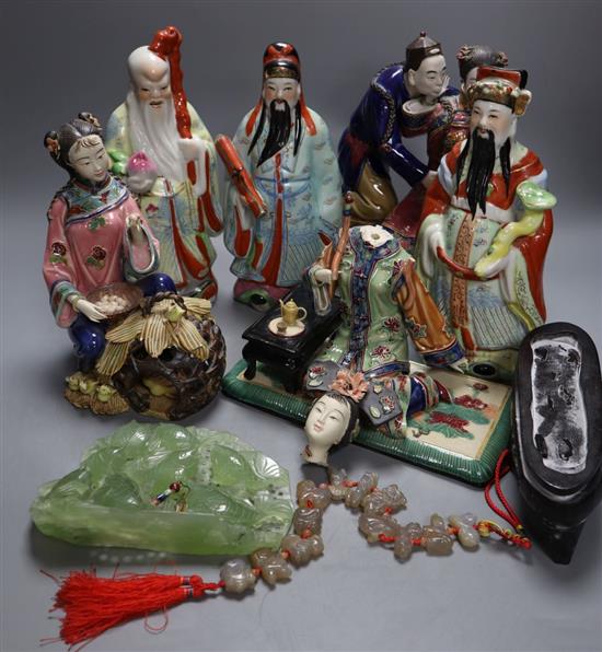 Three Chinese enamelled porcelain figures of immortals, tallest 24cm, three Shiwan type pottery groups, an agate necklace and a carving